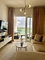Luxury Cana Pearl Penthouse for Sale in Punta Cana – Fully Furnished 2BR with Rooftop Terrace, Golf and Ocean Views & Owner Financing at 5% Interest